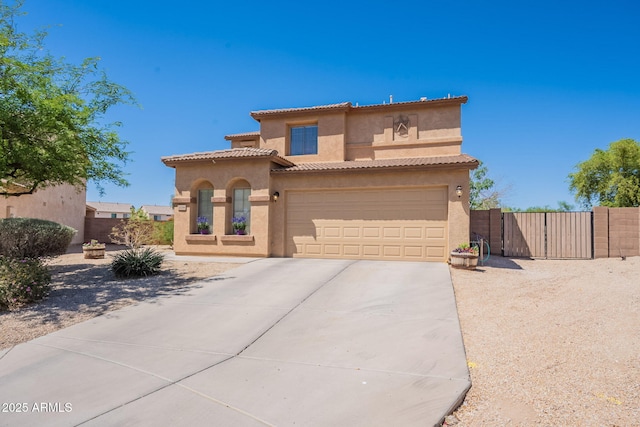 21188 N Duncan Dr, Maricopa, AZ 85138 - mediterranean / spanish house featuring stucco siding, driveway, an attached garage, and fence