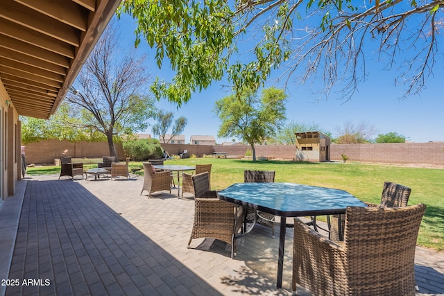 21188 N Duncan Dr, Maricopa, AZ 85138 - view of patio featuring outdoor dining area, a storage shed, and an outdoor structure