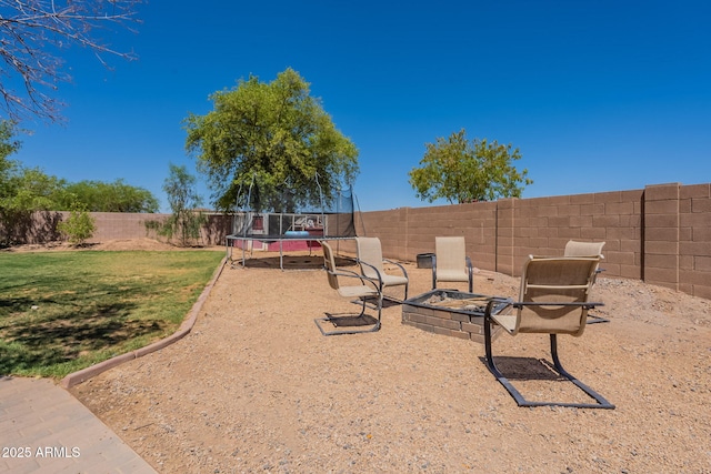 21188 N Duncan Dr, Maricopa, AZ 85138 - view of yard with a trampoline and an outdoor fire pit