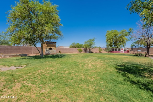 21188 N Duncan Dr, Maricopa, AZ 85138 - view of yard with a trampoline, a shed, and an outbuilding