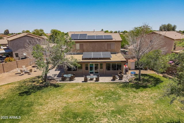 21188 N Duncan Dr, Maricopa, AZ 85138 - back of property featuring a patio, stucco siding, roof mounted solar panels, and a tile roof