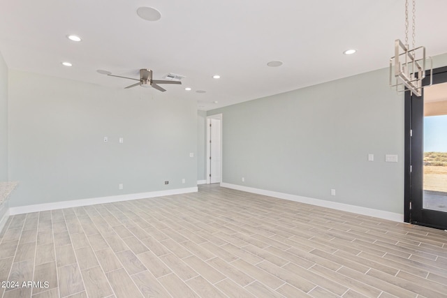 empty room featuring light hardwood / wood-style flooring and ceiling fan