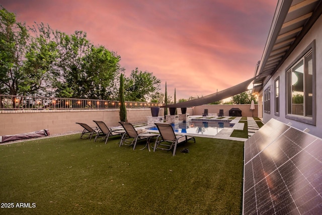 view of yard featuring a patio area, a fenced backyard, and a fenced in pool