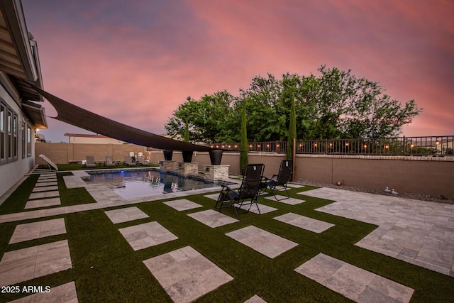 view of swimming pool featuring a fenced in pool, a patio area, and a fenced backyard