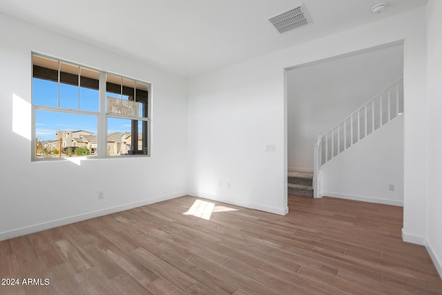 unfurnished room featuring light hardwood / wood-style flooring