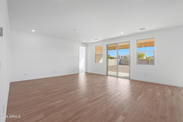 unfurnished room with light hardwood / wood-style floors