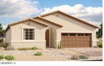 view of front of property featuring driveway and an attached garage