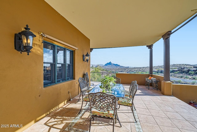 view of patio / terrace featuring a mountain view