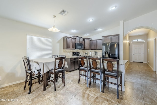 2717 W Bowker St, Phoenix, AZ 85041 - dining area with arched walkways, lofted ceiling, and recessed lighting