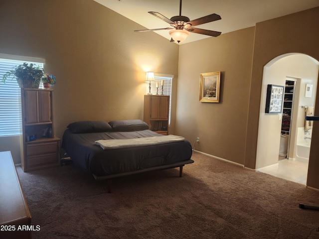 21280 N 96th Ave, Peoria, AZ 85382 - carpeted bedroom with arched walkways and a ceiling fan