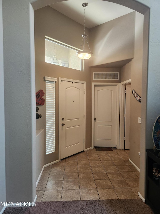 21280 N 96th Ave, Peoria, AZ 85382 - entrance foyer with tile patterned floors and a high ceiling