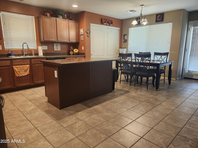 21280 N 96th Ave, Peoria, AZ 85382 - kitchen featuring light tile patterned floors, a kitchen island, a chandelier, pendant lighting, and recessed lighting