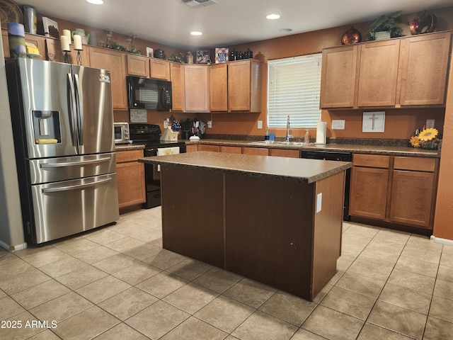 21280 N 96th Ave, Peoria, AZ 85382 - kitchen featuring black appliances, dark countertops, a center island, recessed lighting, and light tile patterned floors