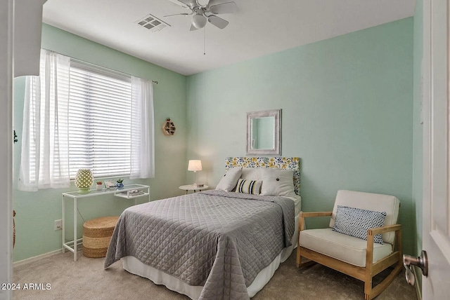 carpeted bedroom with ceiling fan