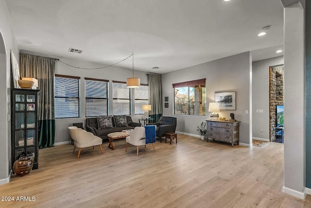 living room with light hardwood / wood-style flooring