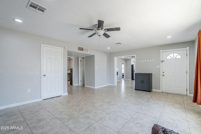 unfurnished living room featuring light tile patterned floors, ceiling fan, recessed lighting, and visible vents