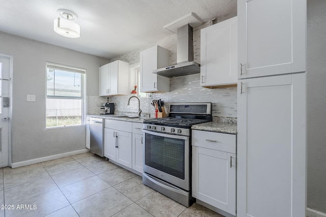 kitchen with wall chimney range hood, a sink, dishwasher, stainless steel range with gas cooktop, and backsplash