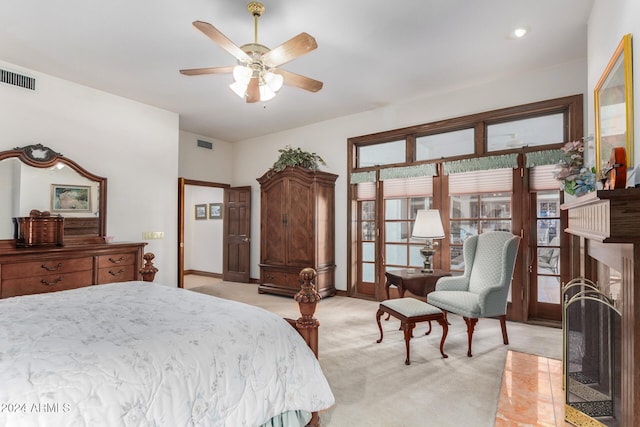 bedroom with light colored carpet and ceiling fan