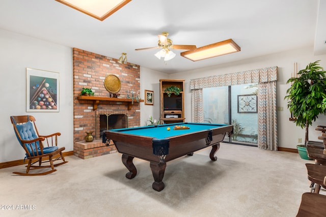 rec room featuring ceiling fan, light colored carpet, billiards, and a brick fireplace