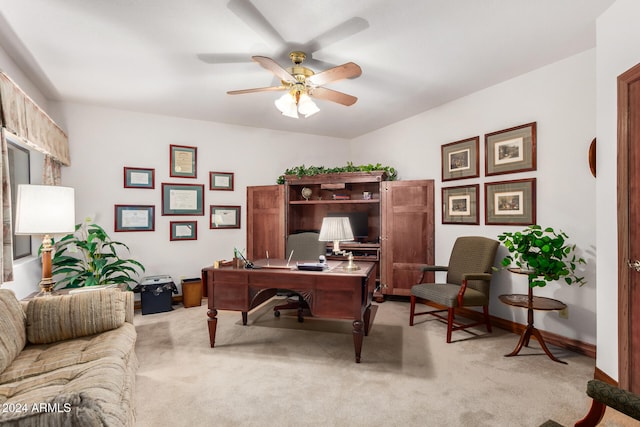 carpeted home office with ceiling fan