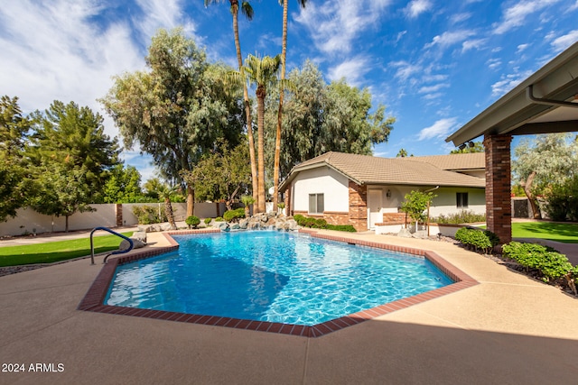 view of swimming pool with a patio