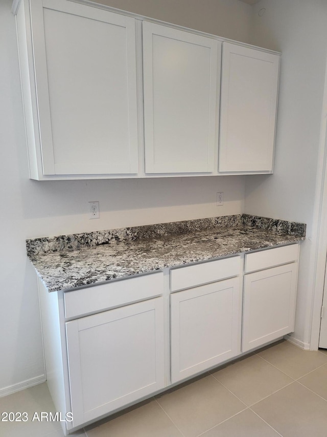 10524 W Bloch Rd, Tolleson, AZ 85353 - laundry room featuring baseboards and light tile patterned floors