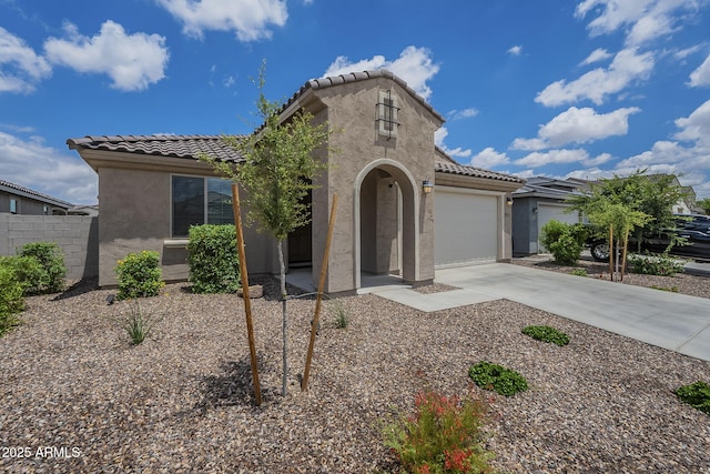 17618 W Medlock Dr, Litchfield Park, AZ 85340 - mediterranean / spanish-style home featuring stucco siding, a tiled roof, concrete driveway, and an attached garage