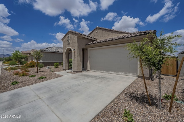17618 W Medlock Dr, Litchfield Park, AZ 85340 - mediterranean / spanish-style house with concrete driveway, a garage, stucco siding, and a tile roof