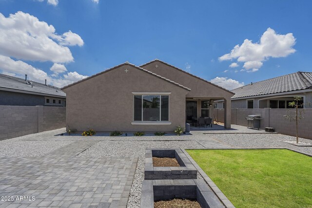 17618 W Medlock Dr, Litchfield Park, AZ 85340 - rear view of house with a patio area and stucco siding