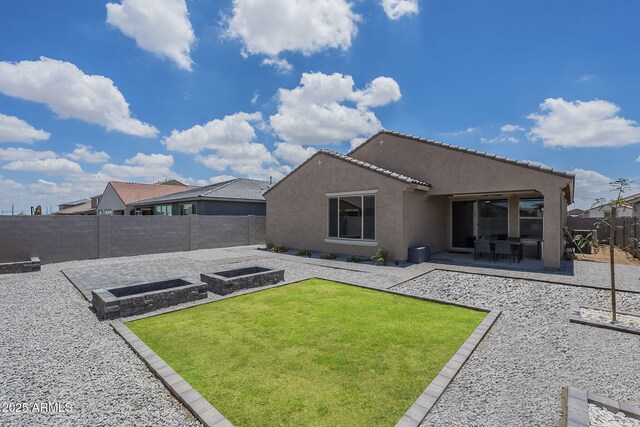 17618 W Medlock Dr, Litchfield Park, AZ 85340 - rear view of house featuring stucco siding and a patio