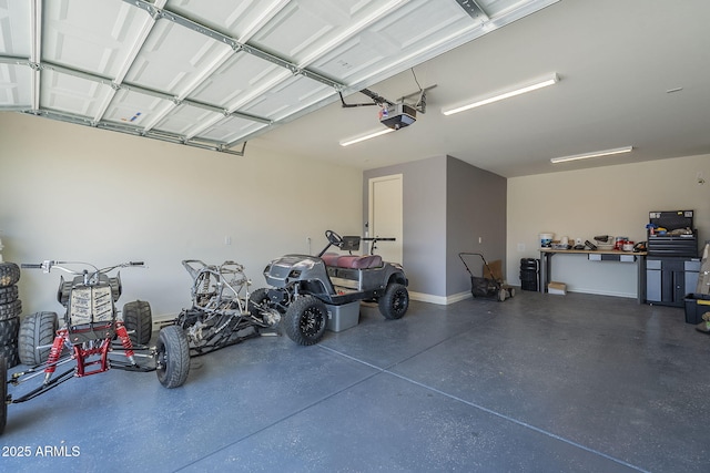17618 W Medlock Dr, Litchfield Park, AZ 85340 - garage featuring a garage door opener and baseboards