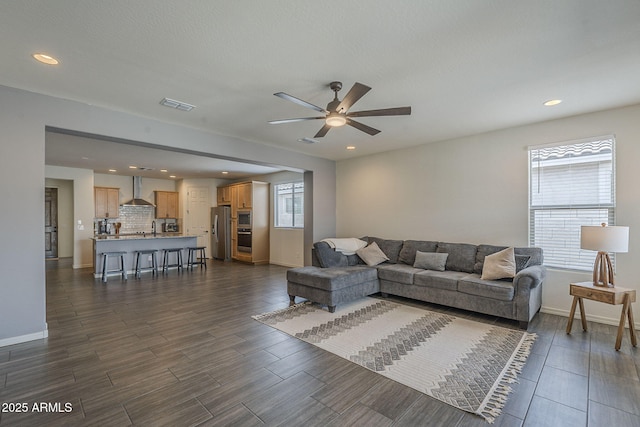 17618 W Medlock Dr, Litchfield Park, AZ 85340 - living room with a ceiling fan, wood tiled floors, baseboards, and recessed lighting
