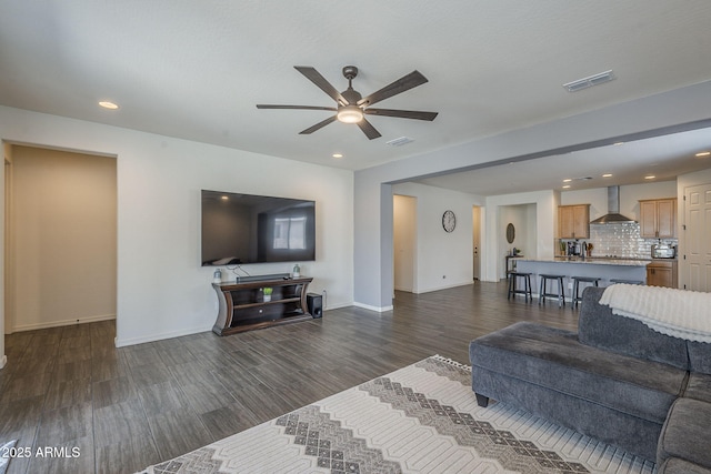 17618 W Medlock Dr, Litchfield Park, AZ 85340 - living area featuring ceiling fan, dark wood-type flooring, baseboards, and recessed lighting
