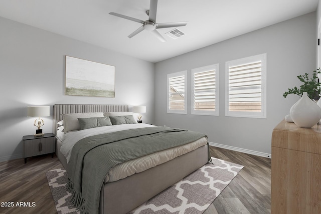 bedroom with ceiling fan and hardwood / wood-style flooring