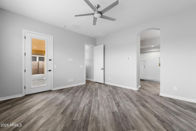 unfurnished bedroom with ceiling fan and hardwood / wood-style flooring