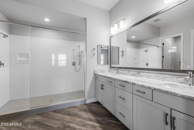 bathroom featuring vanity and a tile shower