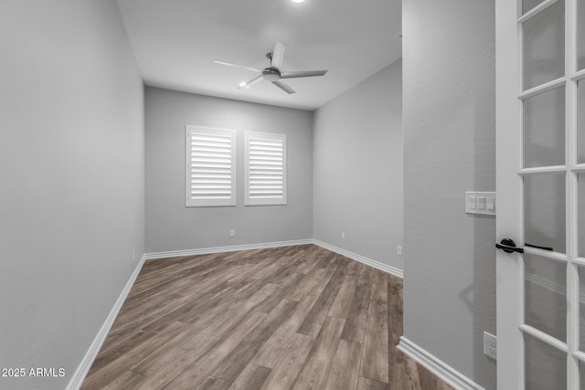 empty room featuring ceiling fan and light hardwood / wood-style flooring