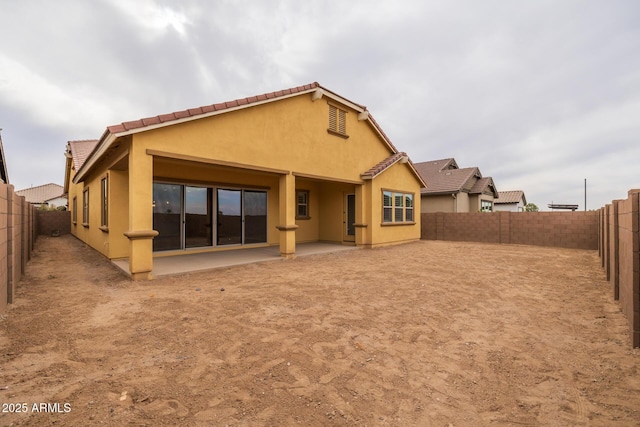 back of property featuring a patio