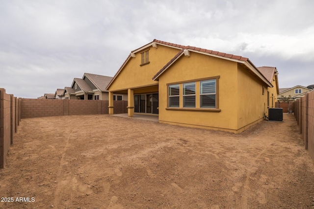 back of house featuring cooling unit and a patio