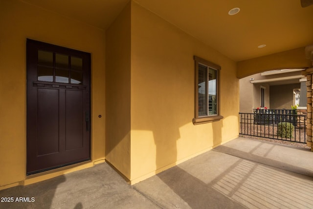 entrance to property featuring a porch