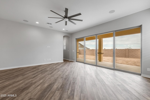 unfurnished room featuring ceiling fan and hardwood / wood-style flooring