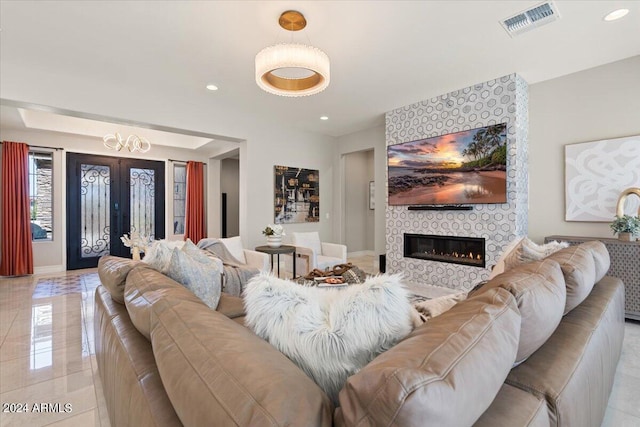 living room featuring a large fireplace