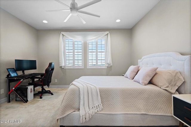 bedroom with ceiling fan and light colored carpet