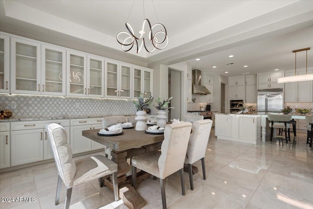 dining area featuring an inviting chandelier