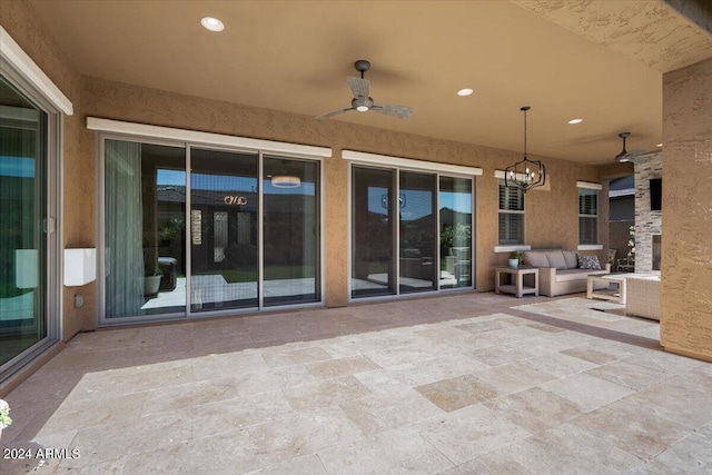 view of patio featuring ceiling fan and an outdoor living space