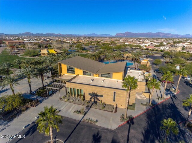 birds eye view of property with a mountain view