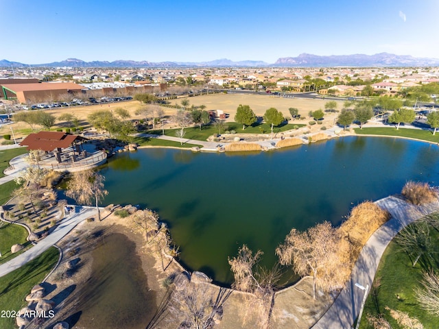 birds eye view of property with a water and mountain view