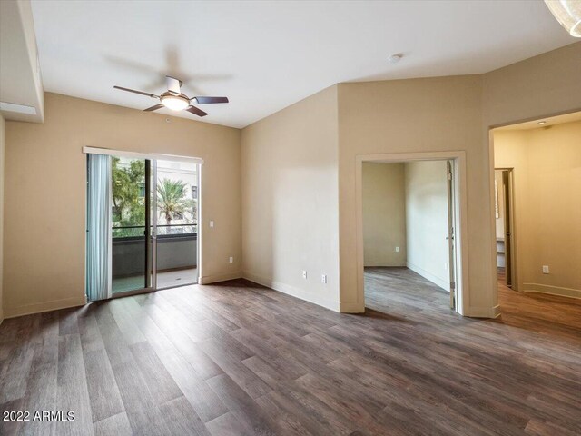 spare room with wood-type flooring and ceiling fan