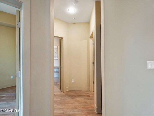 corridor featuring hardwood / wood-style floors