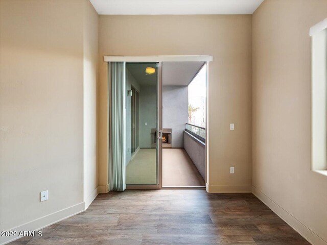 spare room featuring wood-type flooring